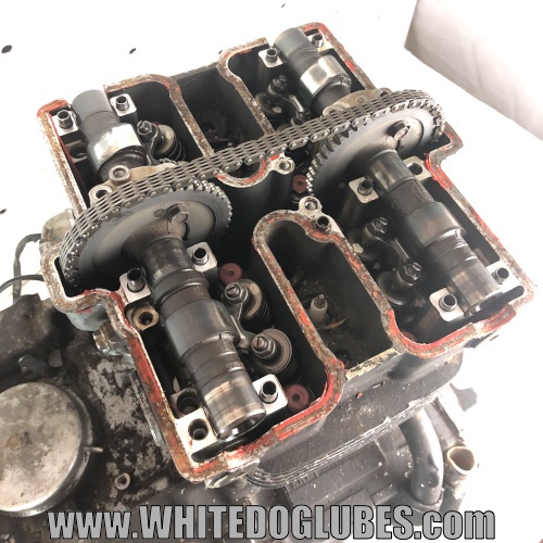 What does a motorcycle cylinder head do?